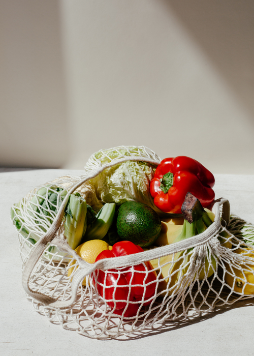 grocery bag filled with vegetables