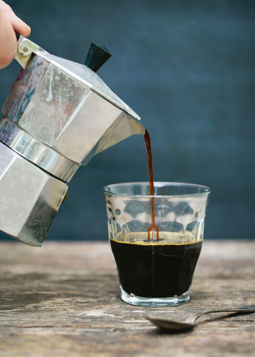 Pouring Coffee Into Cup