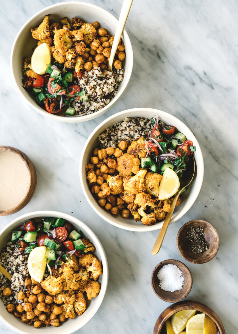 delicious vegan buddha bowls with chickpeas, salad and cauliflower