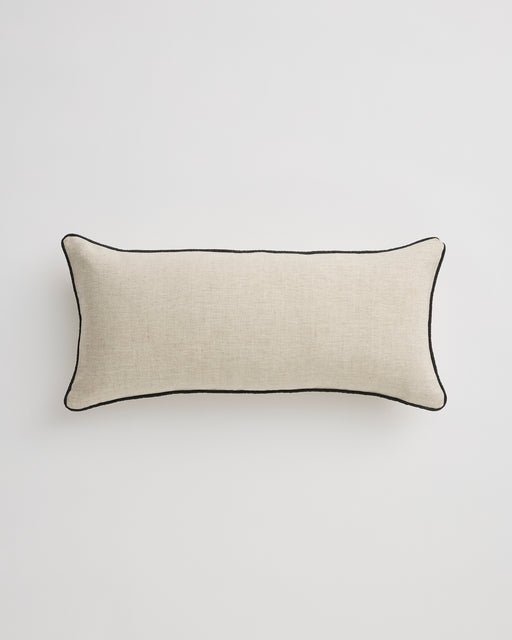 The Bed Threads Oatmeal & Charcoal 100% French Flax Linen Piped Lumbar Cushion Cover features striking charcoal piping on beige linen and is shown on a plain white background.